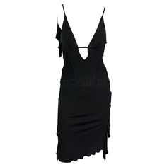 Presenting a chic black ruffle Gucci slip dress, designed by Tom Ford. From 2003, a plunging neckline, spaghetti straps, and an alluring exposed back meet artfully placed straps, creating a perfect silhouette. The dress is made complete with draped ruffles and form-accentuating darting that fuse to create a piece that is sensual, dark, and irresistibly seductive. Approximate measurements: Size - 40IT Bust: 28" - 32" Waist: 24" - 28" Hips: 32" - 42" Shoulder to hem: 39" 100% Rayon Viscose Gucci V-neck Dress For Women, Chic Gucci V-neck Dress, Gucci By Tom Ford, Tom Ford Gucci, Ford Black, Gucci Dress, Black Ruffle, Dress Sleeveless, Ruffle Dress