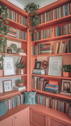 a bookshelf filled with lots of books and plants