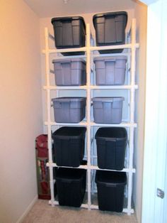 the closet is filled with plastic storage containers