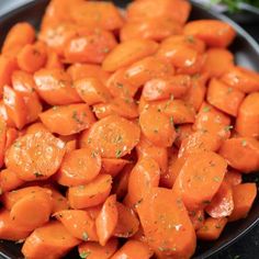 there are carrots that have been cooked in the skillet