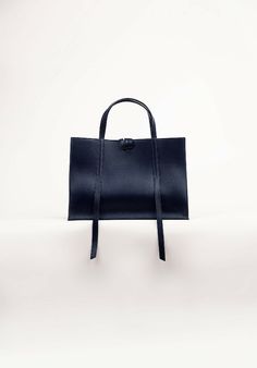 Our debut collection, named after our founder's Mother. The Elise handbag does not come in black and instead comes in two jewel tones - Sapphire Blue and Emerald Green. Original and elegant variations of black with an interesting touch.The Elise is handmade by the same artisans as the world's best fashion houses.More information: · 33 x 23 x 12 cm· 100% Nappa leather, Italian· Suede lining· Handmade in Spain· Delivery between 3-9 business days· Fits 13inch laptopAbout Voort StudioVoort Studio is Modern Blue Evening Bag, Luxury Blue Satchel As Gift, Elegant Evening Bag With Adjustable Strap, Modern Black Evening Bag With Adjustable Strap, Elegant Blue Square Satchel, Modern Black Evening Satchel, Luxury Black Satchel As Gift, Versatile Black Formal Evening Bag, Luxury Black Satchel As A Gift