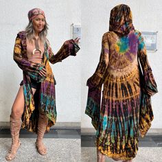 "Hippie tie dye long cardigan with hoody I used best quality of fabric 95% rayon and 5% spandex. There is some weight on this jacket. Layer on the sleeve and front hem. Long  Bell sleeves. High slits both side. 100% hand dye. 2 style Jacket A Jacket BB Model 5'6 30-27-38 One size only as measurements. Chest 34 inches. (lay flat on the floor) Hoody length 18 inches. Shoulder to shoulder 32 inches. Sleeve long 24.5 inches. Length 35\" and 48\" high low style. CARE: Machine wash cold." One-size Long Sleeve Outerwear For Festivals, Hippie Long Summer Outerwear, Long Hippie Summer Outerwear, One Size Hippie Outerwear For Festivals, Hand Dyed Long Sleeve Outerwear For Fall, Summer Hippie Long Sleeve Outerwear, Hippie Festival Outerwear One Size, Bohemian Winter Outerwear With Natural Dye, Oversized Hippie Outerwear For Festivals