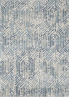 a blue and white rug with an abstract design