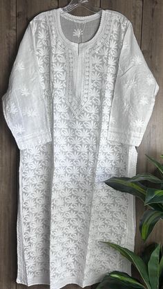 Soft cotton classic white hand embroidered Kurta. Length:47 inches   Matching Cotton Liner Included Embroidery designs may vary White Elegant Kurta With Traditional Fit, Elegant White Kurta With Traditional Fit, Elegant White Kurta With Floral Embroidery, Festive White Traditional Wear With Floral Embroidery, White Straight Kurta With Traditional Fit, White Cotton Traditional Wear With Cutdana, White Traditional Fit Kurta For Festive Occasions, Elegant White Traditional Wear With Cutwork, Traditional White Straight Kurta