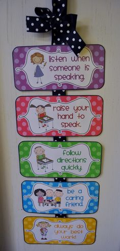 a door hanger with four different colored signs on it