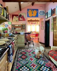 a dog is standing in the middle of a kitchen