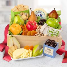 a wooden box filled with assorted fruit and snacks