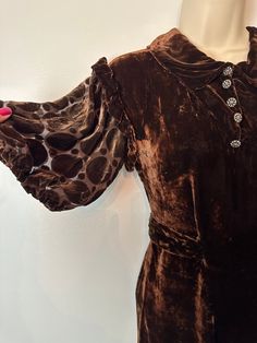 "This is a lovely 1930's all silk velvet dress. It's a luscious chocolate brown with sheer dark chocolate brown burnout style puff/ bubble  sleeves.  The bubble sleeves have light elastic gathers, and ruffle accent.  It's got no holes, rips, or spots noted.  It's in really great condition for its age.  It is quite petite however so please look over the measurements closely to assure it will fit.  I did notice the snaps need some attention, loose etc.. I will sew them down if I have time, but thi Silk Velvet Dress, Dark Chocolate Brown, Dress Measurements, Ask Me Anything, Silk Velvet, Sheer Sleeves, Vintage Silk, Dress Clothes For Women, Velvet Dress