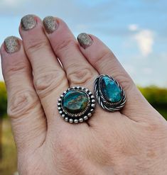 Very unique, one of kind ring. It features 2 gorgeous stones: with one beautifully designed ring shank! These Turquoise Mountain stones stand out above the rest & have such beautiful, rich hues of blues, greens & browns. This ring is a size 7 1/4 & is not very adjustable due to the heavy, solid band. It’s comfortable to wear & is a show stopper! Unique Turquoise Opal Ring With Multi-stone Design, Unique Turquoise Multi-stone Opal Ring, Southwestern Chrysocolla Gemstone Rings, Southwestern Turquoise Chrysocolla Ring, Southwestern Chrysocolla Turquoise Ring, Unique Turquoise Chrysocolla Ring, Silver Smithing, Mountain Ring, Ring Shank