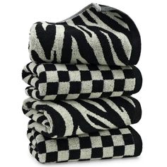 black and white towels stacked on top of each other