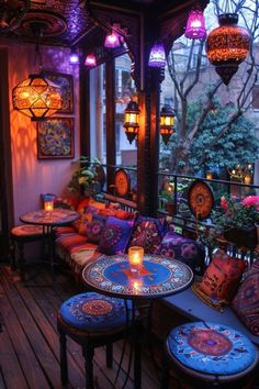 an outdoor seating area is lit up with colorful lights