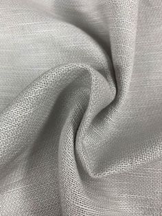 a white fabric textured with some sort of clothing material that is very soft