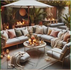 a living room filled with lots of furniture and candles on top of a coffee table