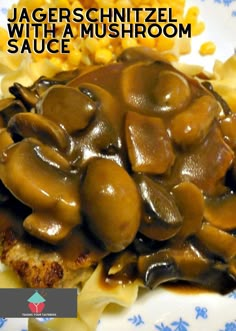 a plate topped with meat covered in mushroom sauce