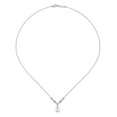 This fashionable necklace exudes timeless sophistication with its shimmering 0.08 carats of accent round cut diamonds and refined milgrain detailing. Rocking a timeless sophistication and refusing to settle for anything less, this necklace shines with 0.08 carats of diamonds and intricate milgrain detailing. Necklace dangles approximately 1/4 inch and pearl measures approximately 7mm Due to the organic nature of pearls, there may be minor variances in color, size and shape from the image Includes necklace box Includes jewelry appraisal Ships fully insured to point of delivery Wedding Akoya Pearl Diamond Necklace With Pearl Chain, Elegant Pear-shaped White Gold Necklace, Elegant Diamond Necklace With Pearl Chain For Wedding, Elegant White Gold Bridal Necklace With Pearl Pendant, Formal Akoya Pearl Bridal Necklace With Pearl Drop, Formal Akoya Pearl Necklace With Pearl Drop, Classic Diamond Necklace With Pearl Pendant, Classic Pearl Drop Necklace For Formal Events, Formal Bridal Pendant Necklace With Pearl Drop