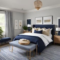 a bedroom with blue and white bedding in it