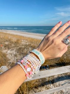 Bohemian White Charm Bracelet For Beach, Bohemian White Charm Bracelet For The Beach, White Bohemian Charm Bracelet For The Beach, Pink Beachy Bracelets For Beach Season, White Strand Bracelets For Beach Season, Pink Strand Bracelets For Beach Style, Bohemian Letter Beads Bracelets For Beach Season, Bohemian Bracelets With Letter Beads For Beach Season, Adjustable Pink Holiday Jewelry