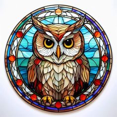 an owl sitting on top of a stained glass window