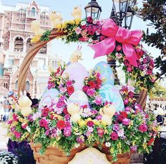 a basket filled with easter eggs and flowers