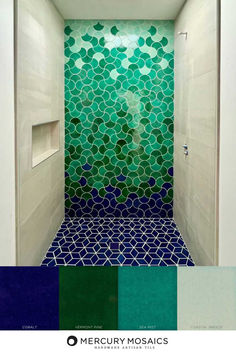 a bathroom with green and blue tiles on the walls