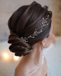 a woman wearing a bridal hair piece