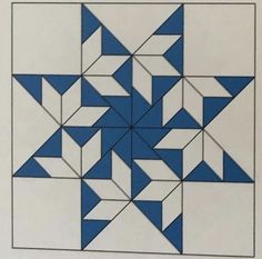 a blue and white quilt block is shown in the shape of an inverted star,