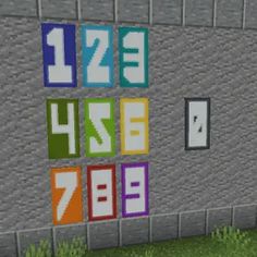 the letters are made up of different colors and sizes on a wall in minecraft