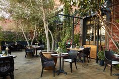 an outdoor dining area with tables and chairs