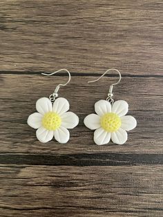 White dangle flower earrings, about the size of a quarter. Super cute,  great gift. Great for spring time. Flower Dangle Earrings, Etsy Earrings Dangle, Handmade Polymer Clay, White Flower, Flower Earrings, Spring Time, White Flowers, Jewelry Earrings Dangle, Polymer Clay