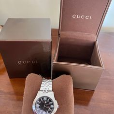 Brand New, Never Worn Gucci Men’s Watch. Ya126201. Black Face, Stainless Steel Band. Gucci Book With Original Certificate Included And Still In Gucci Box (Shown In Pic). Gucci Luxury Watch Accessories With Date Indicator, Gucci Designer Watch With Date Indicator, Elegant Gucci Watch With Date Indicator, Gucci Watch With Date Indicator And Round Dial, Gucci Watches With Subdials For Gift, Designer Automatic Watches As Gift, Gucci Watch With Date Indicator, Gucci Timeless Black Watch, Black Gucci Timeless Watch