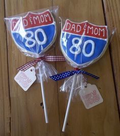 two lollipops are wrapped in plastic and tied with red white and blue ribbon