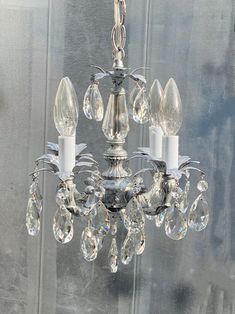 a crystal chandelier hanging from the ceiling