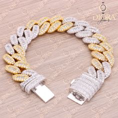 ♥ Materials: 2 Tone Solid 925 Sterling Silver, with Yellow & White gold finish. ♥ Chain Style: Hip Hop ♥ Width: 18mm ♥ Length: 8.0" Inch ♥ Diamond: Cubic Zirconia ♥ Total Carat Wt.: 45.31Cts ♥ Stamp: S925 ♥ Ready to Ship (S925 8" Yellow & White Gold Plated Bracelet) High quality solid sterling silver Ring, Earring, Pendant, Bracelet, Chain and Hip-hop collection from India. A variety of unique designs and styles to choose from. This engagement ring is a beautifully crafted piece of jewelry that Gold Cuban Link Sterling Silver Bracelet, Gold Cuban Link Bracelet In Sterling Silver, Gold Sterling Silver Bracelet With Cubic Zirconia For Anniversary, Gold Sterling Silver Bracelets With Diamond Accents, Gold Bracelets With Diamond Accents In Sterling Silver, Gold Sterling Silver Tennis Bracelet For Wedding, Gold Sterling Silver Jubilee Bracelet With Cubic Zirconia, Yellow Jubilee Bracelet For Anniversary, Anniversary Yellow Jubilee Bracelet