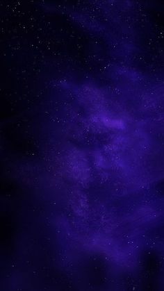 the night sky is filled with stars and purple hues as well as dark clouds