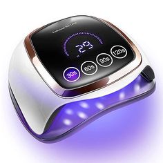 The At Home Gel Nail Dryer is the professional-grade curing lamp for home use. This high-intensity UV light activates the photo initiators in gel nail polish, so it cures nails two to three times faster than other nail dryers. Nail Dryers, Lamp Large, Uv Nail Lamp, Gel Lamp, Gel Nails At Home, Fitness Accessories, Led Nail Lamp, Nail Dryer, Nail Gel Polish