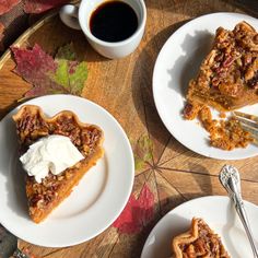 slices of pecan pie on white plates with coffee and autumn leaves in the background