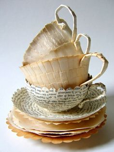 stack of folded paper plates on top of each other with an ornament at the bottom