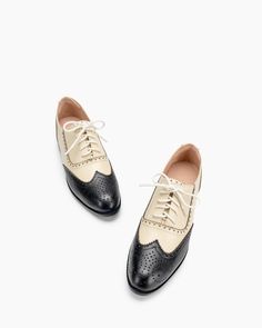 Elevate your footwear collection with the Lace Up Two Tone Flat Brogues Wingtip Oxford. Combining classic brogue details with a contemporary two-tone design, these shoes are perfect for anyone seeking to make a stylish statement while enjoying all-day comfort. Product Details h2 { text-align: center; margin-bottom: 20px; } .tab-container { display: flex; border-bottom: 2px solid #ddd; margin-bottom: 20px; } .tab { flex: 1; text-align: center; padding: 10px; cursor: pointer; font-weight: bold; bo Summer Wingtip Dress Shoes With Brogue Detailing, Chic Wingtip Oxfords With Brogue Detailing, Summer Wingtip Oxfords With Brogue Detailing, Summer Wingtip Oxfords For Office, Flat Oxfords With Brogue Detailing For Office, Flat Brogue Oxfords For Office, Summer Round Toe Dress Shoes For Work, Summer Workwear Dress Shoes With Round Toe, Summer Oxfords With Brogue Detailing And Almond Toe