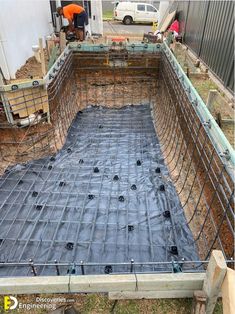 a man standing in the middle of a construction site with scaffolding on it