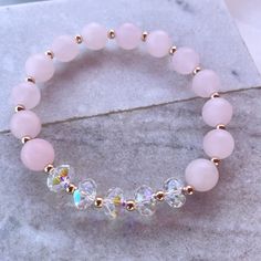 8mm matte rose quartz made with 8mm swarovski crystal rondelles Classy Jewellery, Girly Bracelets, Pearl Art, Stone Bracelets, Swarovski Crystal Jewelry, Diy Bracelet Designs, Swarovski Crystal Bracelet, Beads Bracelet Design, Crystal Beads Bracelet