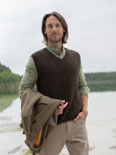 Knitted vest is made of skin soft mohair and merino wool yarns. Minimalist style mens vest is inspired by classic Scandinavian style. Garment features V neckline. Hand knitted vest looks great with casual style shirts. Warm and comfortable woolen vest delivers simplicity, style and ability to wear this sweater whenever you are spending time in nature or going to the theater, restaurant with your family or friends.  Composition: 30% Mohair wool, 70% Superfine Merino Wool Model's heigh: 181 cm  We Wool Vest Sweater For Fall, Knitted Wool Vest For Fall, Sleeveless Wool Sweater Vest For Fall, Casual Tweed Vest For Winter, Wool Sweater Vest, Sleeveless Merino Wool Vest For Fall, Casual Knitted Wool Vest, Casual Brown Wool Vest, Mens Knitted Sweater Vest