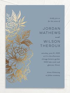 a blue and gold wedding card with flowers on it