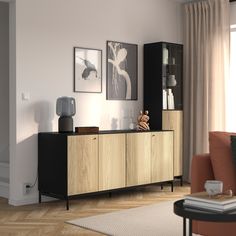 a living room scene with focus on the sideboard and cabinet in the foreground