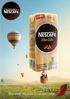 an advertisement with hot air balloons in the sky and a coffee box floating above it