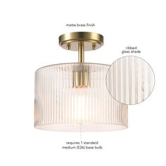 a semi flush ceiling light with pleated glass shades and brass finish, shown from the front view