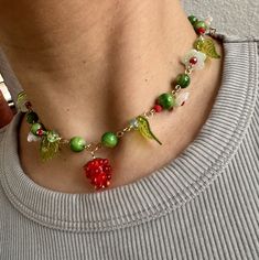 One of a kind fun flowery fruit necklace. 15inches long Trendy Flower Pendant Necklace For Gift, Trendy Flower Choker Necklace (gift), Trendy Flower Choker Necklace Gift, Trendy Flower Choker Necklace As Gift, Trendy Flower Choker Necklace For Gift, Trendy Handmade Flower Necklace For Gift, Trendy Flower Shaped Beaded Necklaces As Gift, Trendy Flower Beaded Necklaces As Gifts, Trendy Green Flower Shaped Necklaces