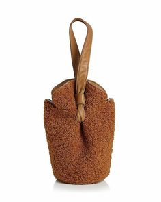 Elizabeth and James Women's Bag French Fry Teddy Small Bucket Bag Camel Shoulder strap. Magnetic closure; lined. Can be worn as a wristlet. 6"w x 3.5"d x 9"h; 5" strap drop. Polyester; trim: leather; strap: leather. Color: brown/Camel Elizabeth and James Women's Bag French Fry Teddy Small Bucket Bag Camel Brown Top Handle Pouch For Shopping, Brown Rectangular Pouch With Detachable Handle, Chic Brown Shopping Pouch, Chic Brown Pouch For Shopping, Brown Top Handle Pouch For Daily Use, Travel Pouch With Detachable Handle In Brown, Brown Handheld Pouch With Detachable Strap, Brown Tote Pouch With Adjustable Strap, Brown Pouch Phone Bag For On-the-go