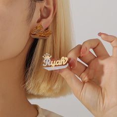 These Two-Color Double-layer Welded Name Crown Earrings are a beautiful addition to any jewelry collection. Handmade with meticulous craftsmanship, each earring is carefully designed and created to ensure a unique and personalized piece. Made with high-quality stainless steel, these earrings are durable and long-lasting. The design features a double-layered crown shape, with the option to customize the earrings with a name of your choice. This personalized touch adds a special and sentimental element to the earrings, making them an ideal gift for friends, family, or even for yourself. The minimalist style of these earrings makes them suitable for everyday wear, allowing you to showcase your personal style effortlessly. Highlights: - Handmade item: Each pair of earrings is individually craf Earrings Name, Crown Earrings, Name Earrings, Waterproof Jewelry, Name Jewelry, Personalized Gifts For Her, Jewelry Earrings Studs, Minimalist Fashion, Women's Jewelry