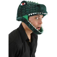 a man wearing a green alligator hat