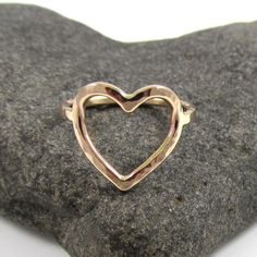 Gold Heart Ring~ Send a gift of love, let your loved one know they are loved with this sweet heart ring, each ring is hand forged with 14k gold fill and hammered and polished to a beautiful shine. Great gift for the sweetheart in your life! *This listing is for 1 14k gold fill heart ring made with 14 gauge wire.* **Each ring is a one of a kind, hand shaped and hammered and will vary.** Also available in sterling silver~ https://www.etsy.com/listing/119635194/silver-heart-ring-love-valentines-day Cute Heart Ring For Valentine's Day Anniversary, Adjustable Heart Ring For Wedding On Valentine's Day, Adjustable Heart Ring For Valentine's Wedding, Rose Gold Heart Ring For Gift, Cute Wedding Rings For Valentine's Day, Heart-shaped Heart Beads Ring For Gifts, Heart Shaped Bead Ring Gift, Heart Shaped Beaded Heart Ring, Heart-shaped Jewelry For Bridesmaid Gift On Valentine's Day